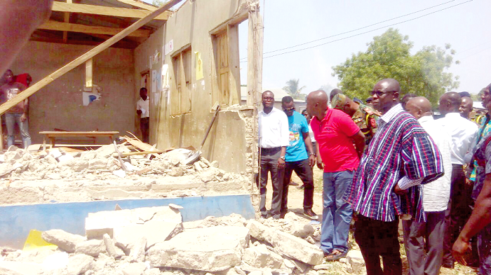 Mr Kwaku Asoma-Cheremeh (in smock) and other officials inspecting the extent of damage Mr Kwaku Asoma-Cheremeh (in smock) and other officials inspecting the extent of damage